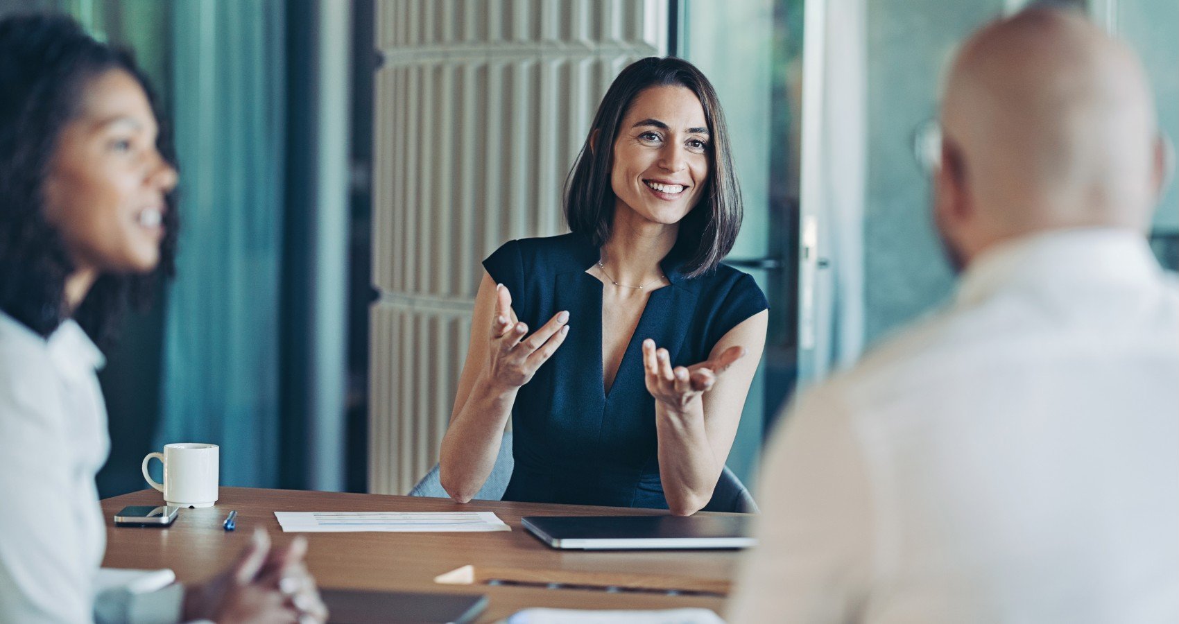 Business meeting two women one man