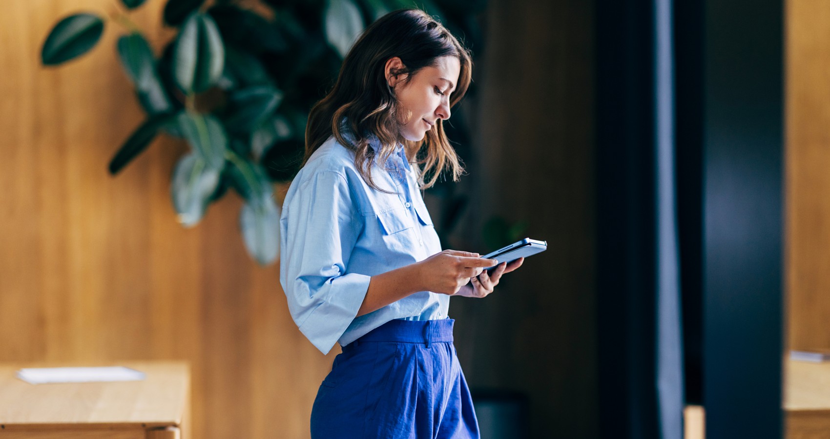 Woman using a tablet in a contemporary office