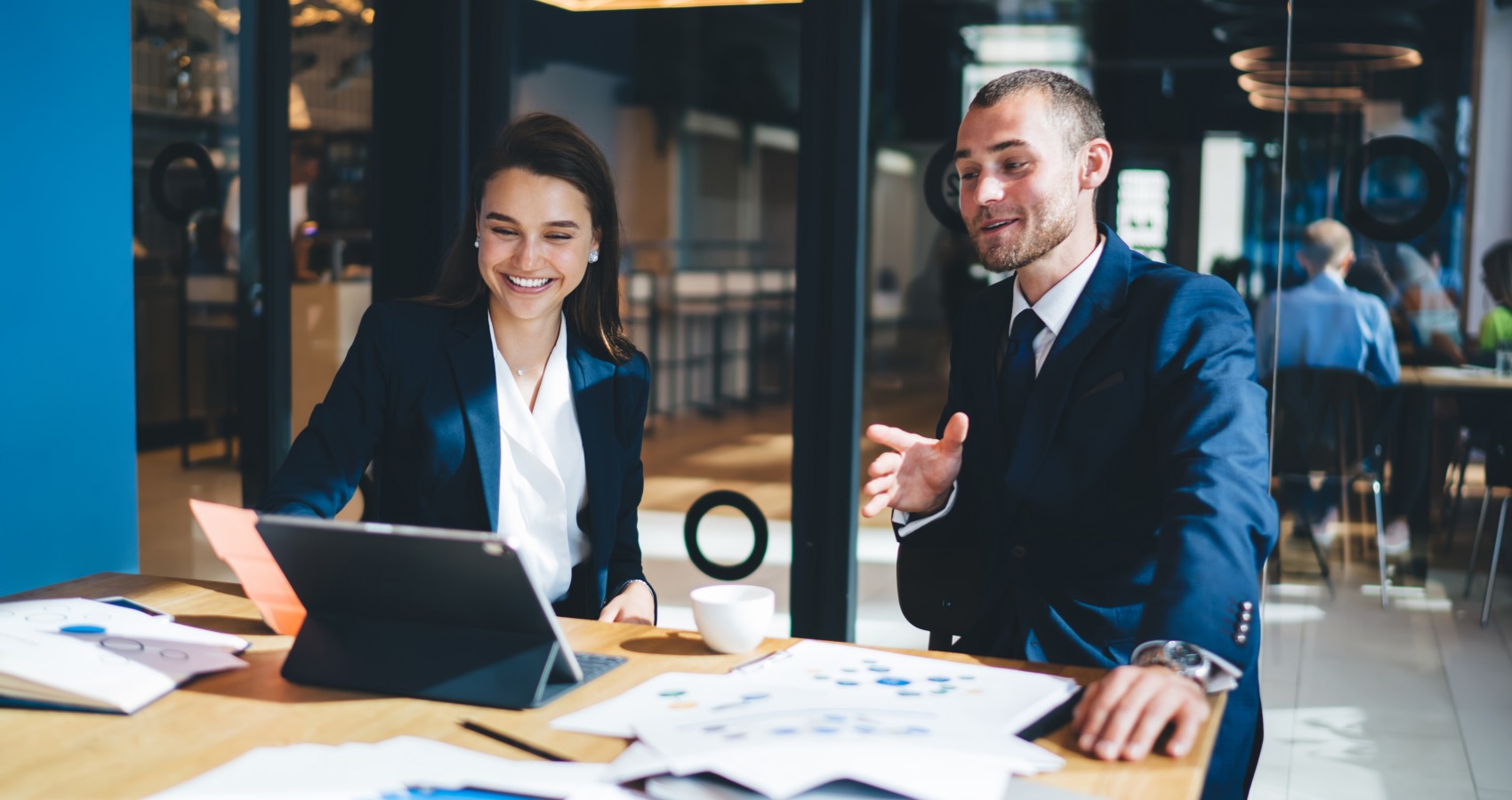 Male and female executives office meeting
